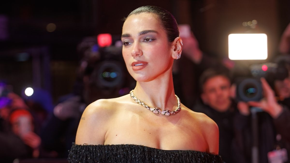 Dua Lipa's White Shirt Teeters on a Button in Bulgari Ad